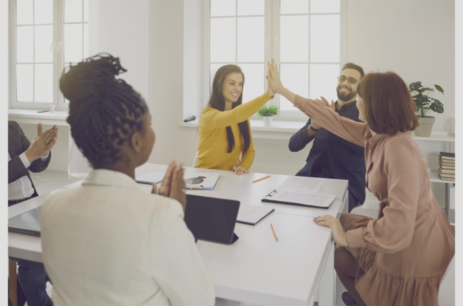 Students discussing real-world economic scenarios in group setting